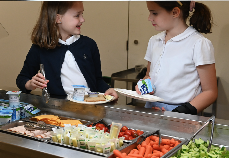 lower school student getting lunch